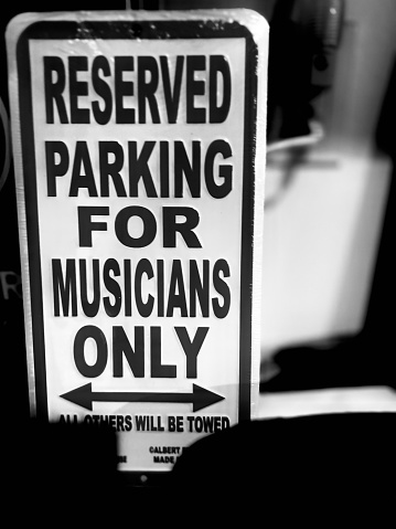 Black and white photo of sign no parking