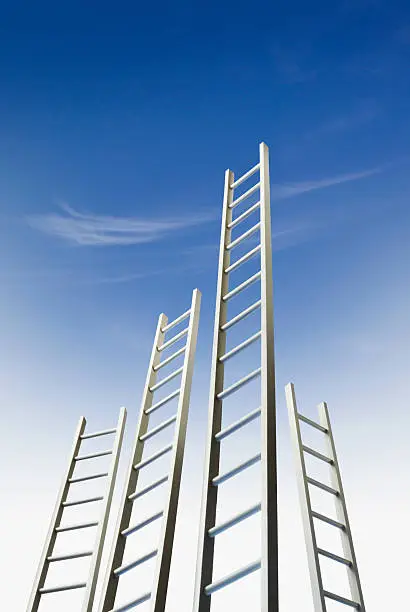 Four ladders standing against a blue sky.