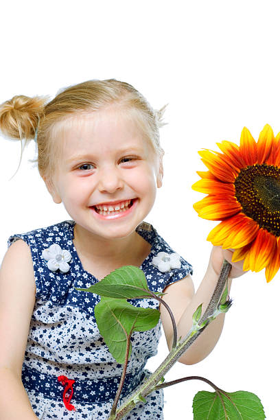 istock cute girl holding flower 173034772