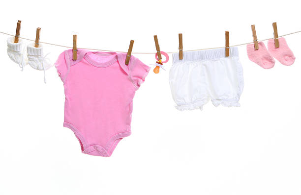 Baby goods hanging on the clothesline stock photo