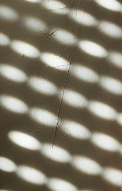 istock Shadow from the blinds on the concrete wall on a sunny day, Interior design. Abstract background, banner, pattern, texture. Gray, white colors. Copy space. 1730352757