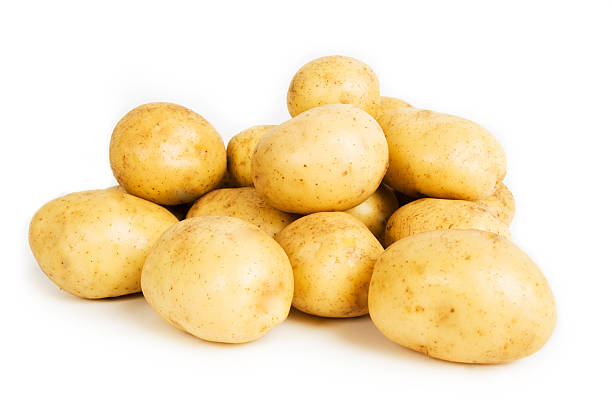 istock A pile of potatoes on a plain white background 173036047