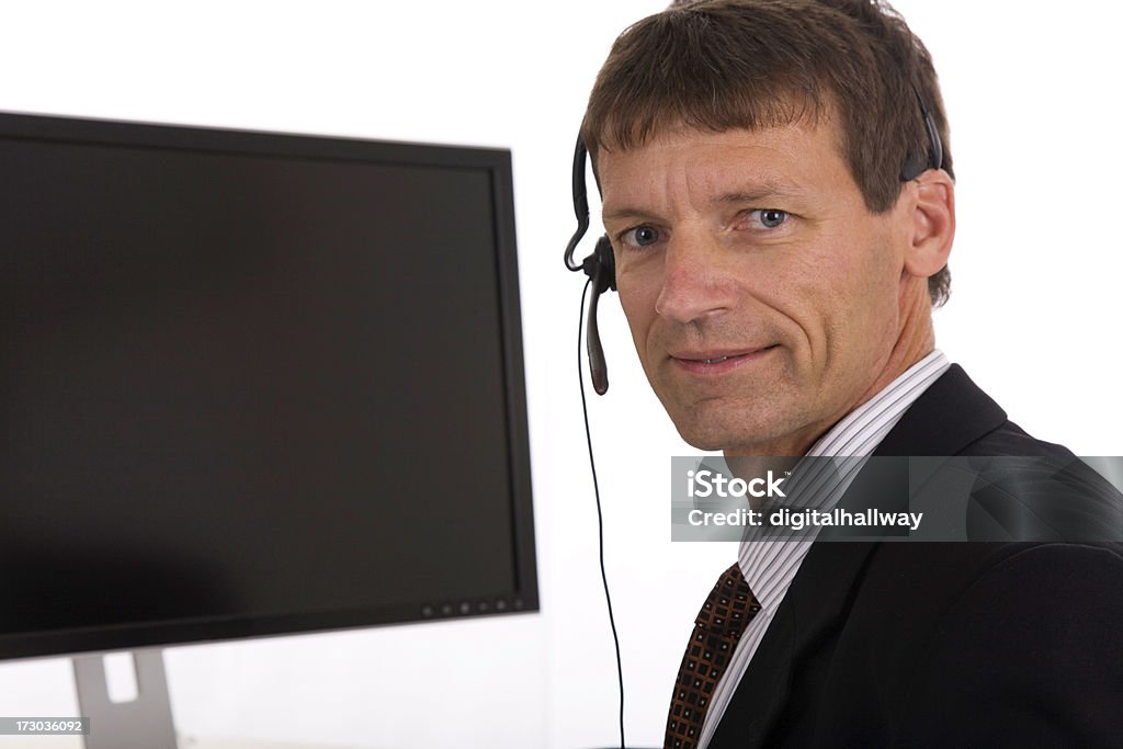 Representante do serviço de assistência ao cliente - Royalty-free A usar um telefone Foto de stock