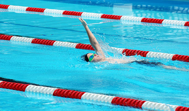 istock Young Boy Swimming Backstroke in Race 173036570