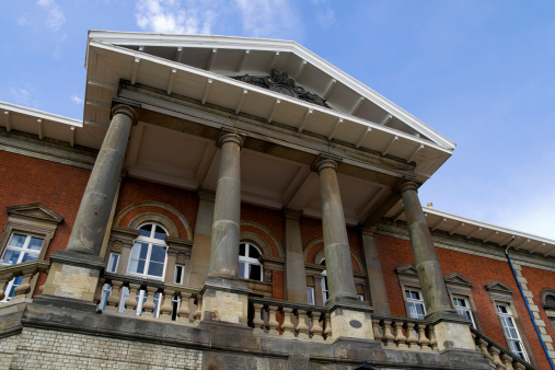 The impressive portico of an old official building in Ipswich, Suffolk, England.