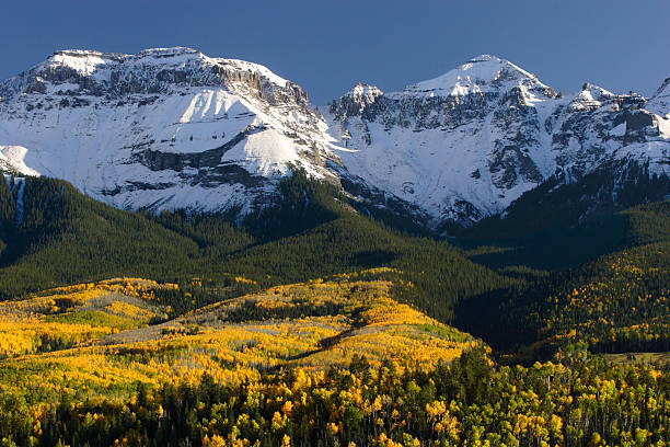 istock Snow Covered Mountain Peaks and Autumn Aspen 173037138