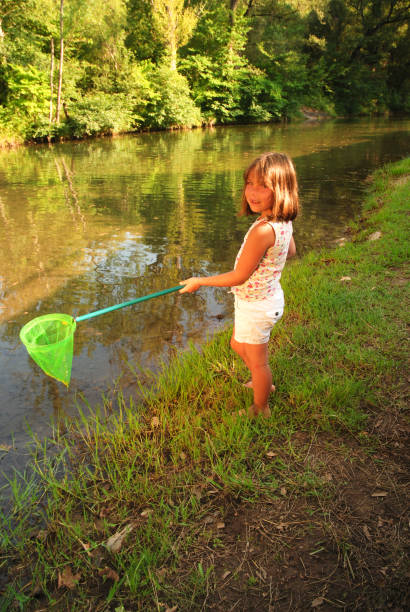 istock Girl fishing with a net 173037147