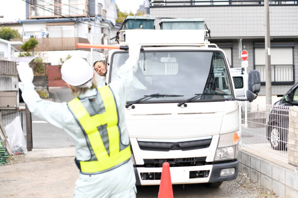 istock A man who is a traffic director guiding trucks with guide lights 1730371677