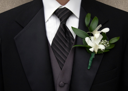 Close up of groomsman wearing Tuxedo. Shallow dof.