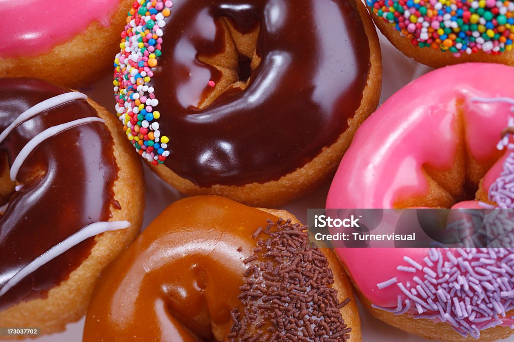 Donuts Closeup A full frame shot of iced dounts. Doughnut Stock Photo