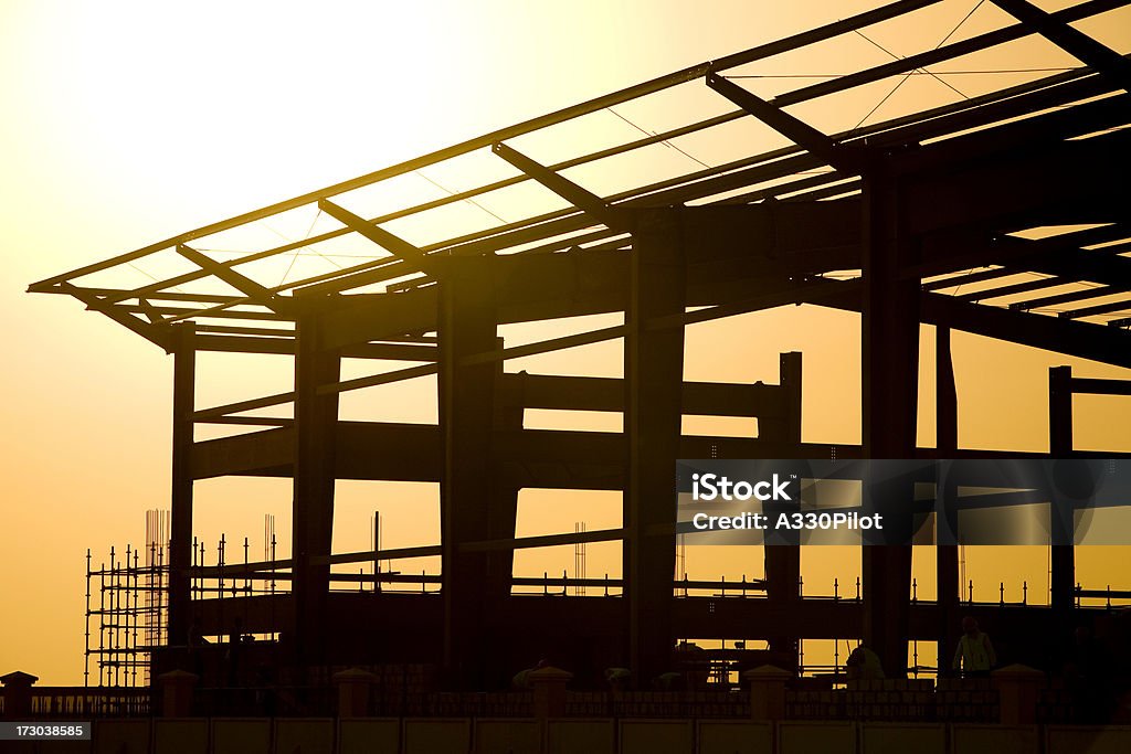 De Construction au coucher du soleil - Photo de Ouvrier du bâtiment libre de droits