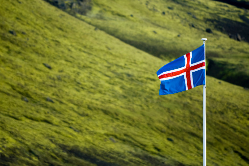 Icelandic flag shot somewhere in mountains.