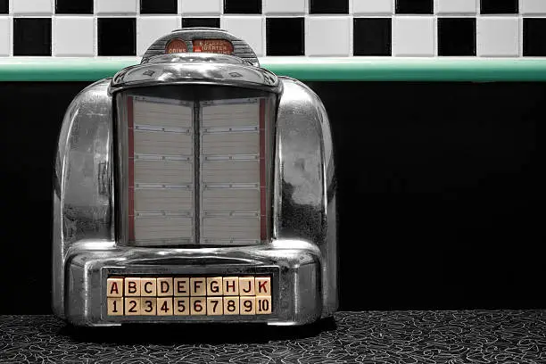 A table top jukebox at an old 1950's style diner.