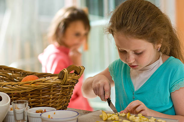 istock Little girl cook the fruit salad 173038997