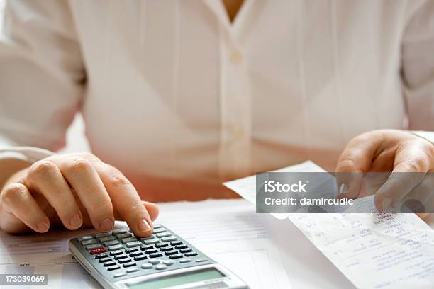 Businesswoman Calculating Data Stock Photo - Download Image Now - Bank Statement, Examining, Calculator