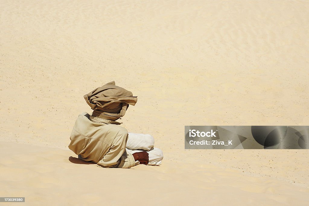 Bedouin Bedouin lying in Sahara desert Adult Stock Photo
