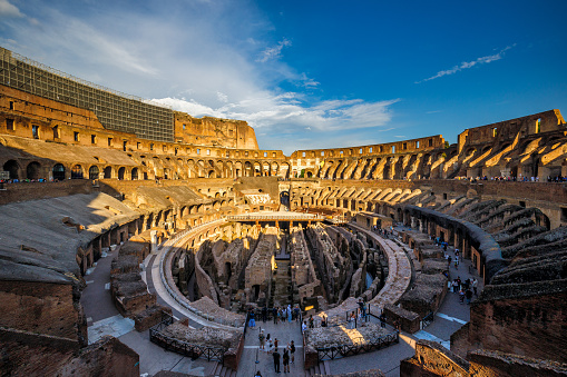 ROME, ITALY - MAY 9, 2022: The interior of The Colosseum at sunset.