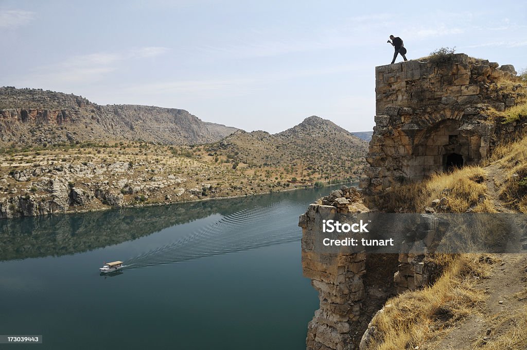 Rumkale and Firat River in Halfeti, Gaziantep, Turkey A photographer is shooting an image at top of old ruins. Gaziantep City Stock Photo