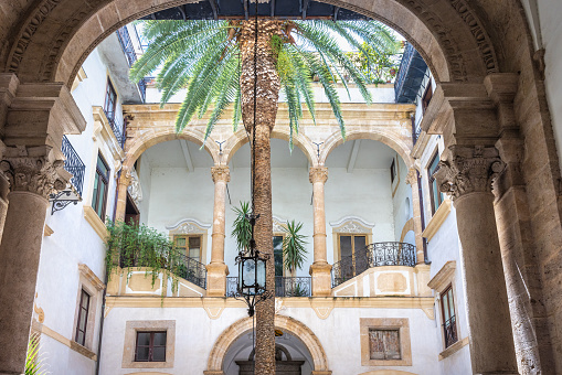 PALERMO, ITALY - JULY 18, 2023: Courtyard of a historic house.