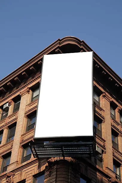 Photo of Blank billboard on the corner of an apartment block