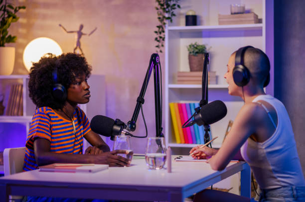 istock Two co-hosts are discussing topics and making video content in a podcast studio 1730408584