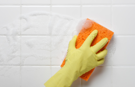 Cleaning the bathroom tiles.For more chore related images click on link below:
