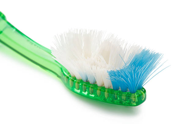 Worn out toothbrush stock photo