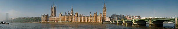 Parliament Panorama "Large detailed panorama of the Houses of Parliament and Palace of Westminster taken from the south bank of the river Thames, with early morning mist clearing." waterloo bridge stock pictures, royalty-free photos & images