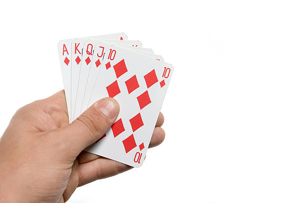 istock Royal Flush Poker in hand with white background 173041819