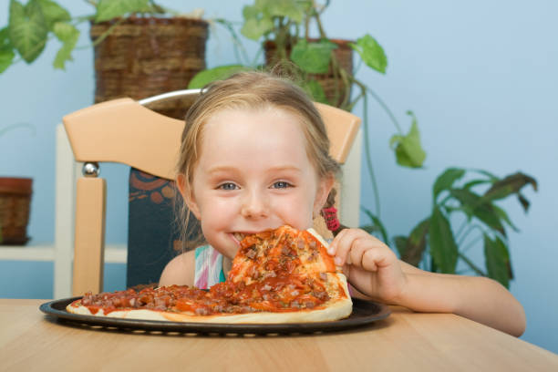 istock Girl eat pizza 173041936