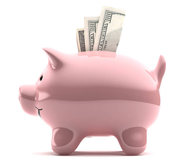 Large pink piggy bank filled with notes