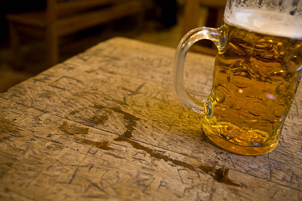 istock Mug of beer on a pub table 173042376