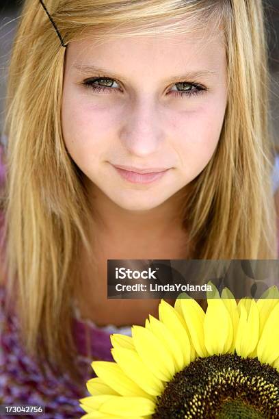 Teen And Sunflower Stock Photo - Download Image Now - 14-15 Years, Adolescence, Beautiful People
