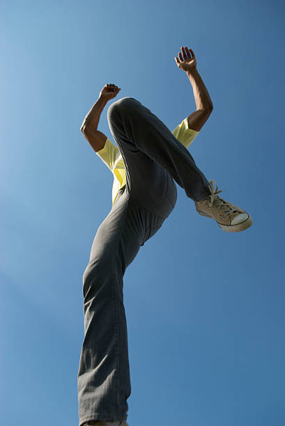 istock Man in Jeans Jumps into Blue Sky 173042936