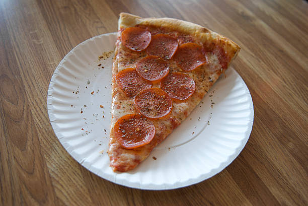 istock Paper Plate Pepperoni Pizza on Formica Table 173043476