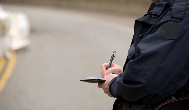 Close-up of police issuing a fine ticket stock photo