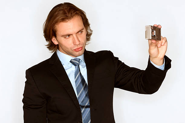 istock Businessman photographs himself 173043726