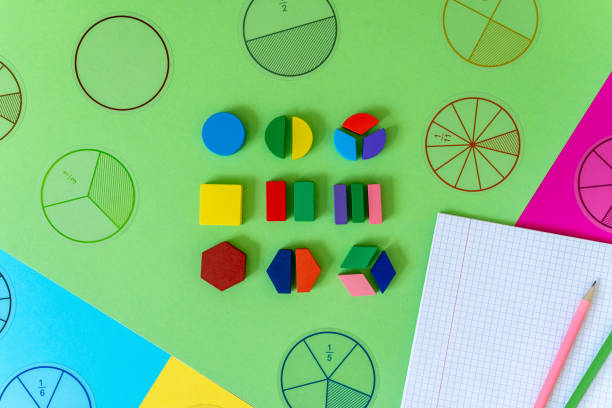 istock Colorful math fractions, numbers on green background. Interesting, fun math for kids. Education, back to school concept 1730453662