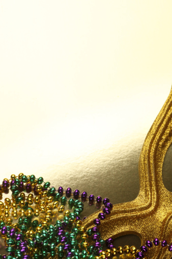 Mardi Gras beads and Gold Mask