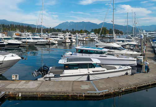 Some of the yachts and other recreational craft moored at Coal Harbour Marina, Vancouver, BC, Canada