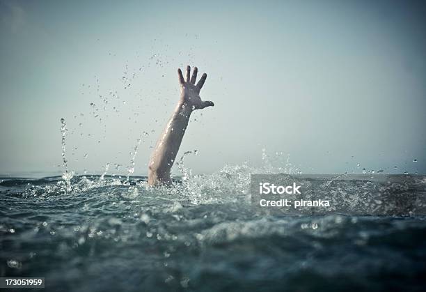 Hand Emerges Splashing Water From Below Stock Photo - Download Image Now - Drowning, Sea, Water
