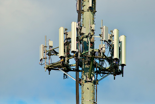 Close-up of cellular telephone antennas on a telecommunications tower.
