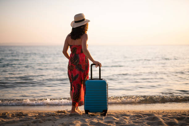 istock Female traveller enjoying the sea. 1730556587