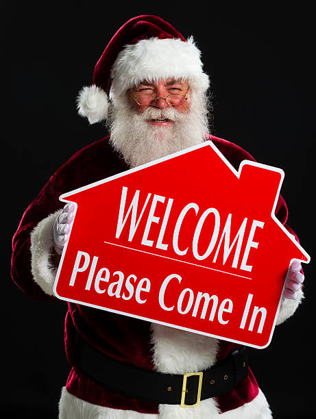 istock Santa Claus with a Real Estate Sign 173056325