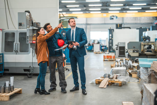 istock Multi-Ethnic Team Working Together In A Manufacturing Factory 1730563969