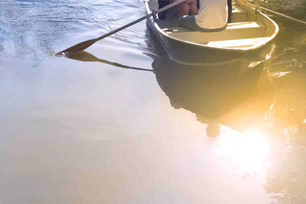 istock couple navigating a relationship with a rowboat reflecting on calm water on a casual date with copy space 1730619441