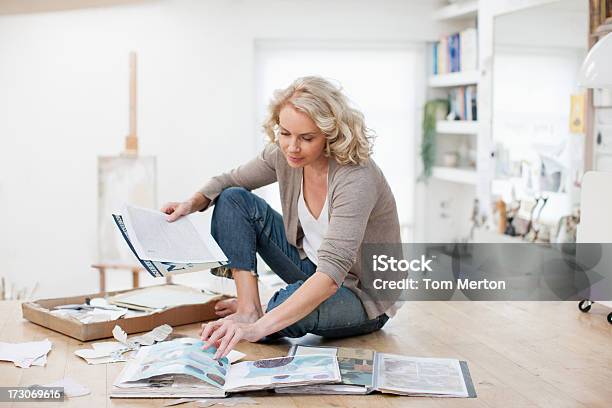 Woman With Photograph Album And Scrapbook Stock Photo - Download Image Now - Photo Album, Women, Organization