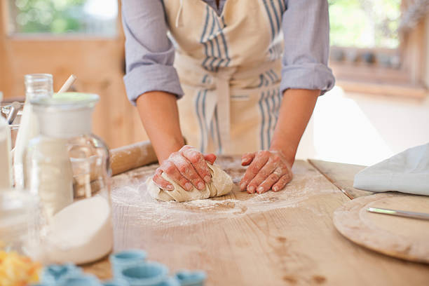 Woman kneading dough on kitchen counter  baking bread stock pictures, royalty-free photos & images