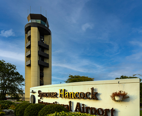 Syracuse, NY - September 2023: Syracuse Hancock International Airport sign and control tower.