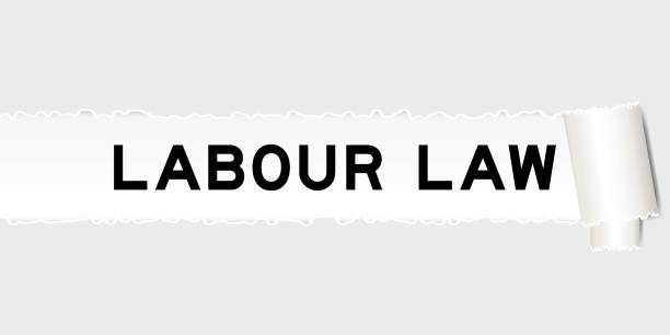 istock Ripped gray paper background that have word labour law under torn part 1730701703